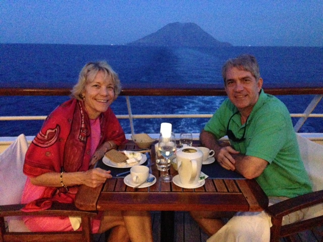 Best table on the ship, with the volcano Stromboli in the background (still smoking)